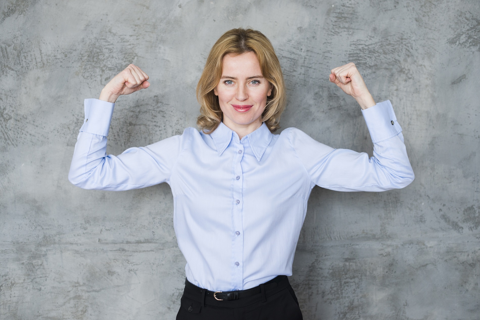 business-woman-showing-arm-muscles