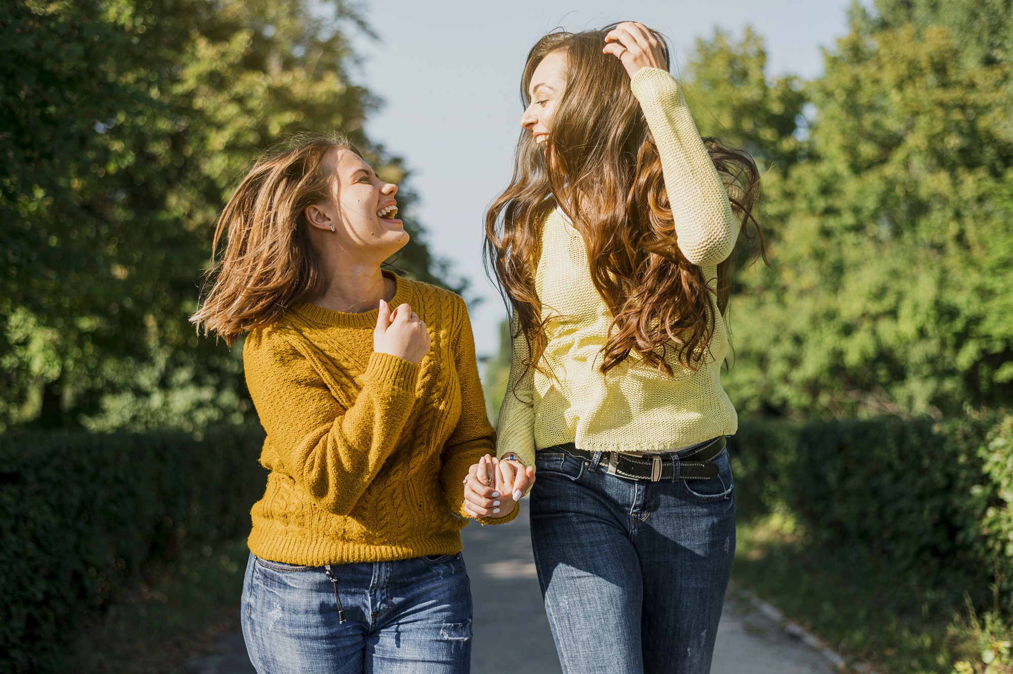 front-view-happy-girls-looking-each-other