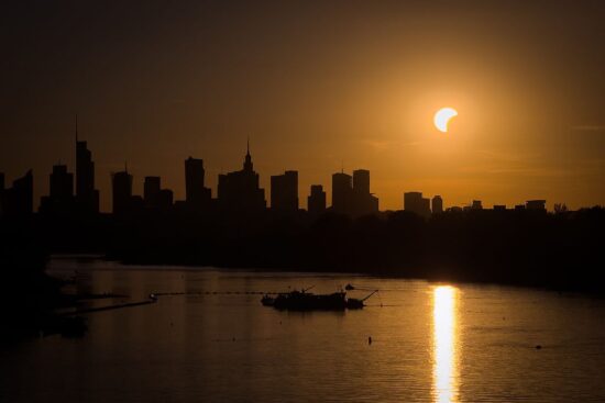Solar Eclipse At Sunset In Warsaw